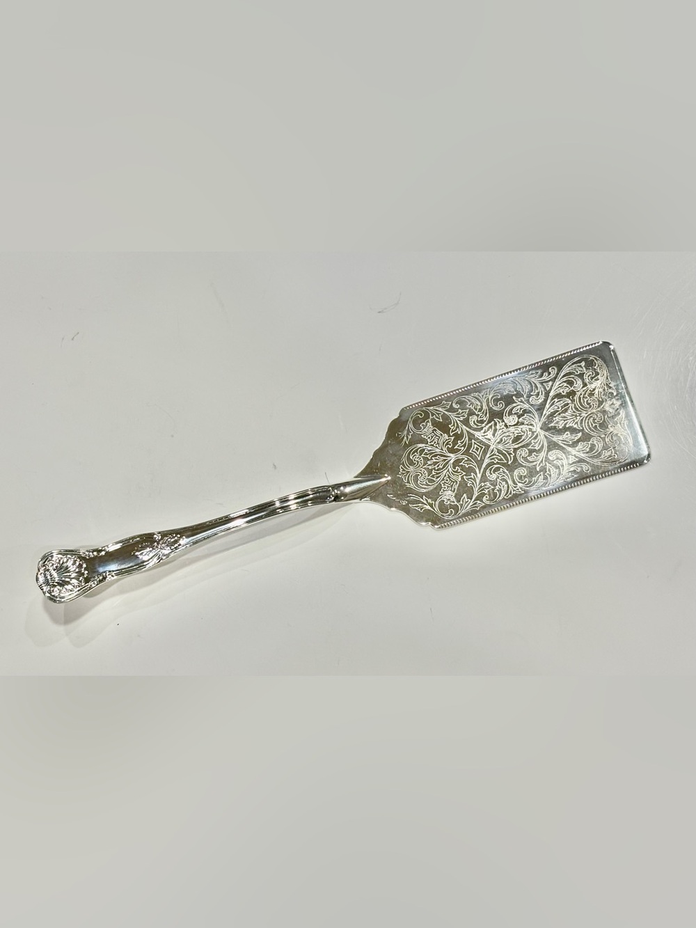 Vintage Polished Silver-Plated Server with Ornate Engraved Details